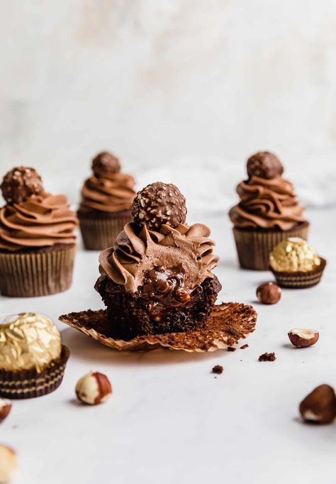 Ferrero Rocher Tres Leches, Ferraro Rocher Desserts, Ferrero Rocher Cupcakes Recipe, Ferraro Rocher Cupcakes, Chocolate Hazelnut Cupcakes, Ferro Rocher Cupcakes, Ferrero Cupcakes, Chocolate Filled Cupcakes, Whipped Nutella