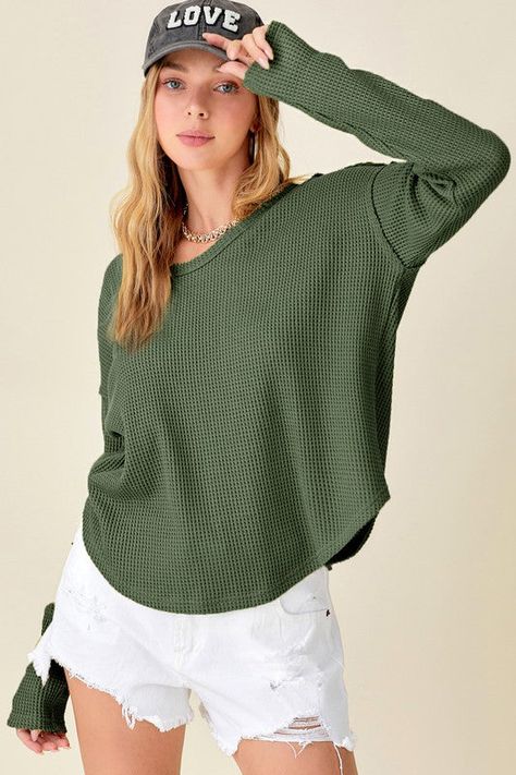 Thick waffle-knit top with raw edge and stitch detail. Every day casual wear- a loose regular fit. 65% POLYESTER/35%COTTON Hand wash only cold, no dryer Waffle Toppings, Waffle Fabric, Cozy Tops, Waffle Knit Top, Long Sleeve Knit Tops, Basic Tops, Sheer Fabrics, Waffle Knit, Raw Edge