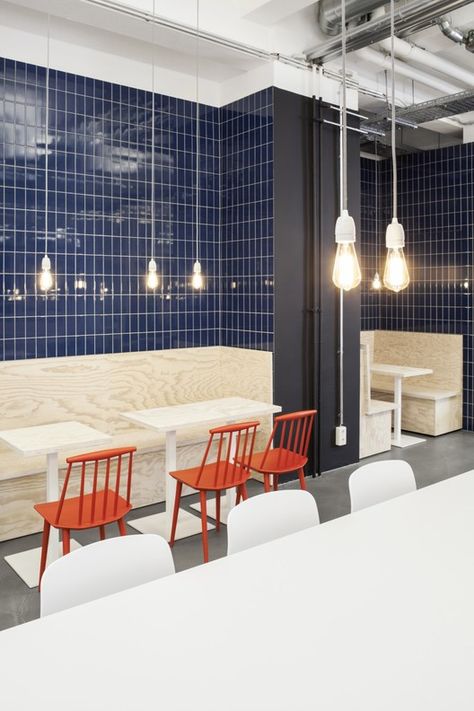 Orange And Blue Restaurant Interior, Seating Area Design, Gray Interior Doors, Factory Restaurant, Canteen Design, Restaurant Staff, Cafeteria Design, Industrial Cafe, Clean Wood