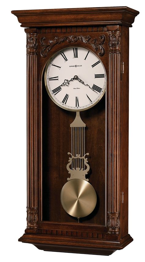 PRICES MAY VARY. Finish in Hampton Cherry on select hardwoods and veneers. This wall clock offers a decorative overlay above the arched glass. Dentil molding accents the pediment and base. Reeded columns with carved acanthus top and bottom caps frame the door. A lambs wool dial features a brushed brass-finished bezel and Roman numerals. Serpentine hands add a sophisticated flair. The brushed brass-finished lyre pendulum swings below The hinged front door opens for easy access to change the batte Chiming Wall Clocks, Howard Miller Wall Clock, Dentil Molding, Rectangle Wall Clock, Dentil Moulding, Howard Miller, Clock Shop, Mantel Clocks, Antique Clock