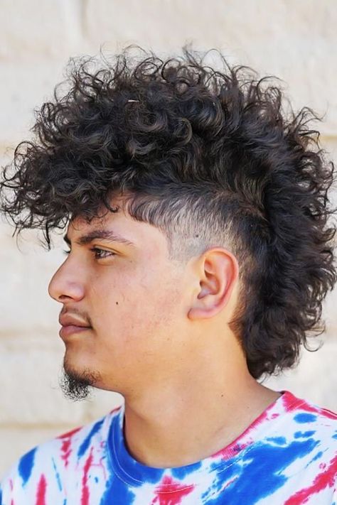 Punk Hairstyle For Curly Hair #punkhairstylesformen #punkhairstyles The variety of punk hairstyles for guys impresses. From medium long mohawks with shaved sides to an undercut faux haw that shorts toward the back, there is plenty of hairstyles that every true punk rocks. #menshaircuts #menshairstyles #mohawk #curlyhairmen Punk Haircut, Curly Mohawk Hairstyles, Mens Short Curly Hairstyles, V Shaped Haircut, Punk Hairstyles, Mohawk Haircut, Mohawk Hairstyles Men, Curly Mohawk, Low Fade Haircut