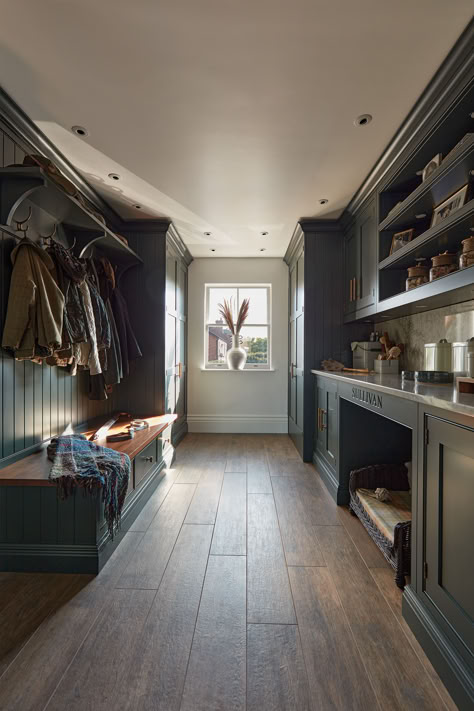 Discover a unique blend of style and functionality with our 'Avocado' dark green boot room and utility design. This thoughtfully designed space caters to all your needs - from laundry to pet necessities, offering a harmonious blend of order and elegance. Every item has its place, transforming the mundane into a beautiful, practical experience. Laundry Boot Room, Pigeon Utility Room, Devol Bootroom, Laundry Boot Room Ideas, Rustic Boot Room, Dark Utility Room, Large Boot Room, Conservatory Utility Room, British Boot Room