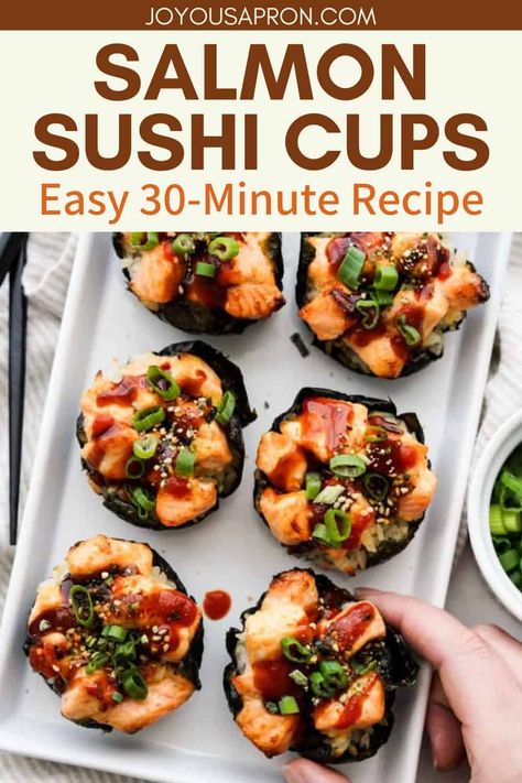 Salmon Sushi Cups - a fun twist to Japanese sushi rolls! Baked in a muffin tin, chewy sushi rice is wrapped in nori and topped with baked salmon, chopped green onions, furikake, unagi sauce and sriracha sauce. Salmon Sushi Cups, Sushi Cups, Joyous Apron, Traditional Sushi, Unagi Sauce, Sushi Bake, Sushi Lunch, Salmon Sushi, Salmon Dishes