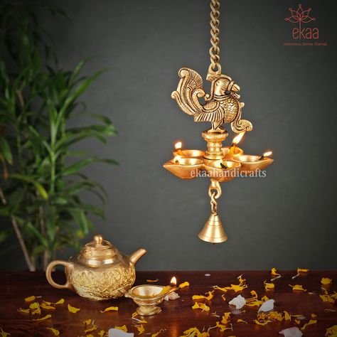 Hanging Diyas In Pooja Room, Hanging Diya, Bird Wall Hanging, Home Decor Traditional, Hall Interior Design, Hall Interior, Pooja Room, Pooja Rooms, Brass Decor