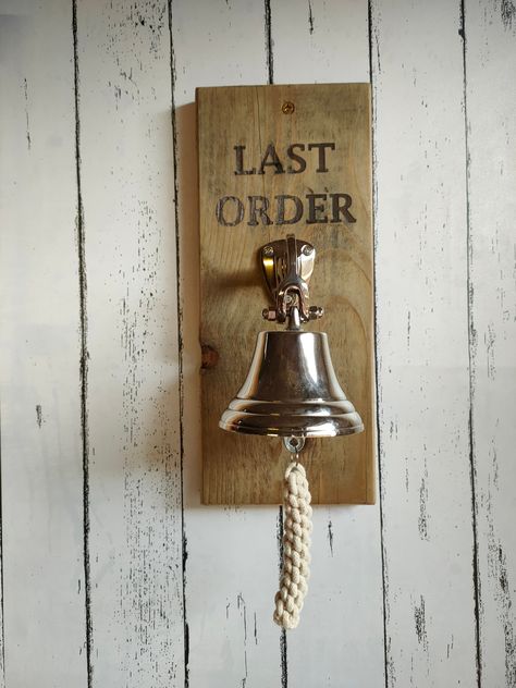 Personalised Last Orders Bell, Bar Accessories, Mancave Accessories Our last orders bell is the perfect accessory for any home bar or man-cave.  The bells is Aluminium, featuring a classic ringer with rope handle the bell is easy to ring and can make a loud, unique sound that is sure to get anybody's attention.  Instead of Last Orders, you can opt for wording of your choice which will be lasered engraved. MAIN PICTURE SHOW  # Natural FINISH -LAST ORDER  #OAK WAX FINISH- Darren's Pub ALL COLOURS Irish Bar Ideas Pub Design, Pub Bar Ideas, Pub Design Interiors, Bar Interior Design Pub, Farmhouse Basement Bar Ideas, British Pub Interior, Country Pub Interior, Pub Decor Ideas, Bar Accessories Ideas