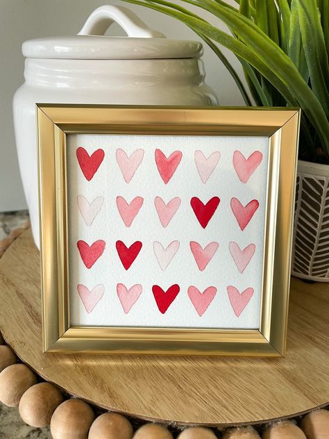 These hand-painted watercolor heart paintings include a gold frame so you can decorate with it or gift it immediately! Frames are 4inx4in. Since these are each hand-painted, the colors and pattern of hearts may differ slightly.  Perfect for Valentine's day, mothers day, birthday, anniversary, or any holiday! Valentine Paintings On Canvas, Valentines Day Painting Ideas On Canvas, Valentine’s Day Painting On Canvas, Pink Heart Painting, Valentines Paintings, Valentines Painting, Heart Paintings, Valentines Day Painting, Flower Making Crafts