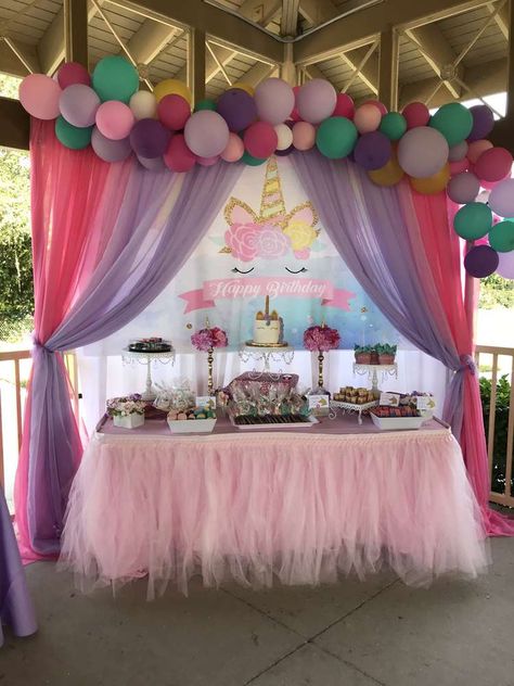 Aria's Unicorn 4th Birthday party | CatchMyParty.com Unicorns Birthday Party, Unicorn Birthday Party Cake, Unicorn Birthday Decorations, Unicorn Birthday Party Decorations, 4th Birthday Party, Unicorn Themed Birthday Party, Cake Table Decorations, Unicorn Party Decorations, Pony Birthday