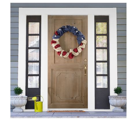 Celebrate your patriotism in a unique and rustic way with this Americana Stars and Stripes burlap wreath. Expertly crafted, this piece beautifully showcases an iconic red, white, and blue motif, making it an ideal decoration for a door, wall, or mantel during Fourth of July festivities. From seasonal celebrations to everyday display, this wreath adds a touch of Americana charm to any space. From Northlight. Fourth Of July Wreath, Colored Burlap, Changing Table Pad, Material Wreaths, July Wreath, Nursery Chair, Outdoor Bar Table, Buffet Display, Tree Shop