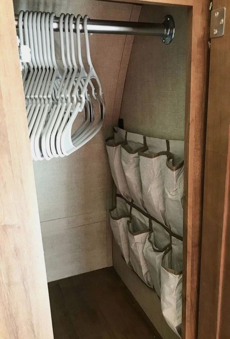 Camper Shell Organization, Camping Shoe Storage Ideas, Rv Linen Storage, Airstream Shoe Storage, Jewelry Organizer For Camper, Rv Slide Out Decor, Trailer Ideas Organizing, Shoe Storage For Camper, Shoe Storage In An Rv