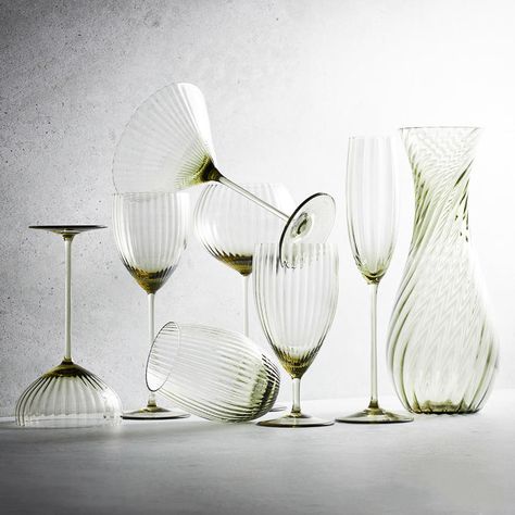 Mouth-blown beauties from a centuries-old glassworks in the rural Czech Republic. Archival forms, elongated and elevated for a very modern feel, these are glasses unlike any you've held and they're ours alone. The optic bowls artfully capture the light, playfully reflecting it back. Our tumbler rests comfortably in the curve of your hand and affords an elevated casual option for anything you are drinking. Sold in Sets of 2 Dimensions: 4.75"H, 3.7" W - 18 oz. (Each) Hand Washing Recommended Lead- Hand Blown Drinking Glasses, Aesthetic Wine Glasses, Unique Drinking Glasses, Wine Glass Display, Unique Glassware, Shaker Table, Glassware Design, Larch Wood, Cocktail Glassware