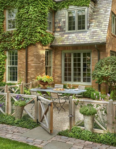 Belgian Beauty - Gardenista Fenced In Cottage Garden, Pea Gravel Patio Front Yard, English Fence Ideas, French Garden Fence Ideas, Patio With Fence Around It, French Country Fence Ideas, Landscape Hedge Ideas, English Cottage Fence, French Country Fence