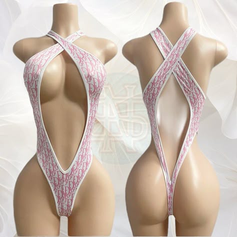 SIZE SMALL! This eye-catching one-piece bikini features a striking monogram pattern in pink on a pristine white background, exuding luxury and style. The daring cut-out design in the front and criss-cross back straps provide a perfect blend of elegance and allure, showcasing your curves in the most flattering way.