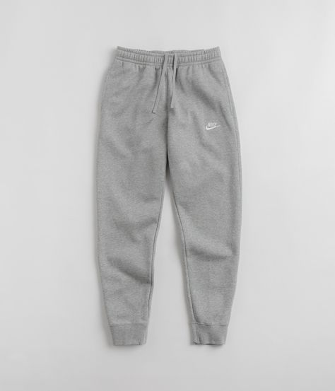 Description Nike Club Fleece Joggers Nike Club Fleece Joggers in Dark Grey Heather, Matte Silver and White. Regular fitting and made from a cotton-polyester blend, these Nike joggers are styled with a brushed fleece lining and an adjustable drawstring waist. Featuring a tapered leg cut and rib knit cuffs, these dark grey Nike Club sweatpants are finished with two side pockets, a single rear pocket and with an embroidered Futura Swoosh logo. Known for their do-more, go-further attitude and for their admiration for sporting progression, Nike is an influential brand that strives to create a sense of community and connection between like-minded individuals. Renamed after the Greek Goddess of Victory and supported by their Nike SB and Nike ACG subdivisions, Nike is a visionary brand that contin Sweatpants Dark Grey, Joggings Nike, Nike Sweatpants Men, Nike Sweatpants Outfit, Grey Nike Sweats, Gray Nike Sweatpants, Nike Hose, Mens Nike Sweatpants, Gray Sweatpants Outfit