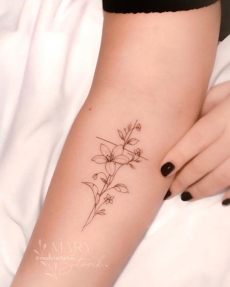 38 Beautiful Lily Tattoo Ideas to Inspire You in 2024 Small Tiger Lilly Flower Tattoo, Tiny Lilly Tattoo, Lilys Aesthetic Flower Tattoo, Cute Lily Tattoos, White Lily Tattoo Small, Delicate Lily Tattoo, Lilly Tattoo Ideas, Waterlilly Tattoo Fineline, Tiny Lily Tattoo