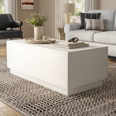 Simple, sleek, and functional- These are all hallmarks of the Tresero collection. With its white lacquered finish, clean lines and a practically hidden push open drawer, the Tresero Coffee Table maximizes storage while maintaining a minimalist aesthetic. | AllModern Carson 48-Inch Coffee Table In High Gloss White Brown/White 17.72 x 48.0 x 23.6 in, Wood | EY10679 | Wayfair Canada Patio Bar Table, Leather Living Room Set, Coffee Table White, Cool Coffee Tables, Traditional Living, Dresser Decor, Traditional Living Room, Modern Sectional, High Gloss White