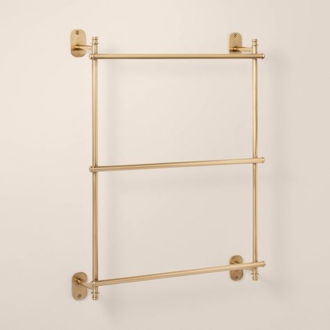 Organize your bathroom towels in style with this Wall-Mounted Brass Ladder Towel Rack from Hearth & Hand™ with Magnolia. This ladder-style towel rack features a wall mountable design with three bars for hanging your bath towels and more in one place. Made from metal in a lacquered brass finish, it easily coordinates with a wide range of bath decor. Hearth & Hand™ with Magnolia: Gather • Create • Enjoy Towel Bar Small Bathroom, Multiple Towel Bars In Bathroom, Guest Bathroom Towel Storage, Towels Small Bathroom, Bathtub Towel Rack, Bathroom Wall Towel Rack, Antique Towel Bar, Bathroom Wall Accessories, Bathroom Shelves Towels