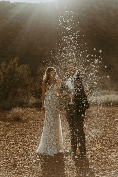 Wedding Champagne Spray Photo, Champagne Wedding Pictures, Champagne Wedding Photography, Champagne Popping Pictures Wedding, Elopement Champagne Pop, Wedding Champagne Photo, Wedding Champagne Spray, Champagne Pop Photoshoot, Champagne Pop Wedding Photo