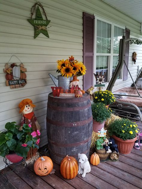 Whiskey barrel, Scarecrow, pumpkins and mums decorating our porch 2016 Fall Porch Decorations, Whiskey Barrel Decor, Primitive Fall Decorating, Barrel Flowers, Wine Barrel Decor, Autumn Porch, Rustic Front Porch, Fall Yard Decor, Fall Porch Decor