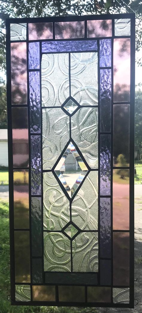 WELCOME to  Southern Star Stained Glass  in Vero Beach,  Florida CLASSIC STYLE   23" x 10"  Stained Glass Window Panel  $185 FREE SHIPPING - selling to lower 48 states only no returns - no custom work CLASSIC STYLE is a real stained glass window that actually will hang vertically or horizontally in your window!    There are 4 loops on the corners for easy hanging.   Pale wine and purple borders surround beautiful clear swirl glass, with three sparkling bevels down the center of the panel.     Ge Bedroom Stained Glass Window, Stained Glass Windows Aesthetic, Hanging Stained Glass Panels, Stained Glass Windows Patterns, Stained Glass Door Panel, Contemporary Stained Glass Panels, Stained Glass Modern, Stained Glass Art Deco, Stained Glass Transom Window