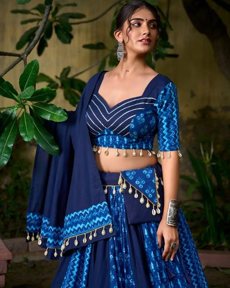 🌟 Elevate your Navratri 2024 with our stunning blue pure cotton Chaniya Choli, adorned with exquisite cowrie shells and a matching purse. Perfect for a night of vibrant celebrations and dance! Embrace elegance and tradition with every step. ✨ #Navratri2024 #ChaniyaCholi #PureCotton #CowrieShells #FestiveFashion #DanceInStyle #WeAreEffortlessly #ElegantTradition #CelebrateInStyle ▪️Lehenga (Stitched) Lehenga Fabric : Pure Cotton Lehenga Work : Plain And Printed With Cowrie (Kodi) Lace Touch ... Blue Chaniya Choli Navratri, Chaniya Choli Poses, Cotton Chaniya Choli, Navratri 2024, Lehenga Stitched, Navratri Collection, Cotton Lehenga, Lehenga Fabric, Navratri Chaniya Choli