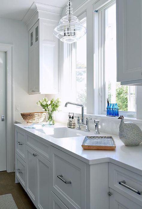 Chandelier Over Sink, Chandelier Over Kitchen Sink, Gray Subway Tile Backsplash, White Marble Backsplash, Pretty Farmhouse, Over Kitchen Sink, Light Grey Kitchen Cabinets, Clear Glass Chandelier, Light Grey Kitchens