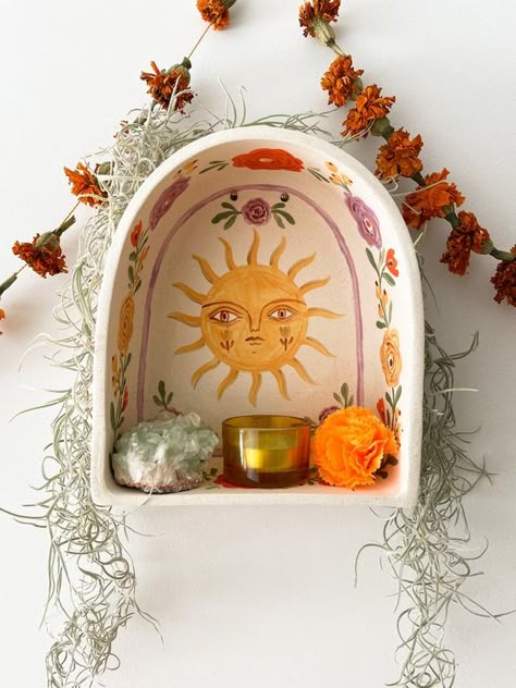 Beauty Break: 06.16.23 | happy buddha breathing Paper Mache Shrine, Air Dry Clay Light Switch Cover, Ceramic Wall Altar, Ceramic Altar Ideas, Hand Building Pottery Ideas Simple, Painted Ceramics Ideas, Sun Altar, Cermanic Ideas, Diy Pottery Ideas