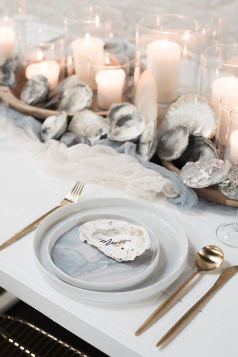 a neutral beach wedding tablescape with fabric runners, seashells, candles, watercolor porcelain and gold cutlery Beach Wedding Table Settings, Nautical Wedding Centerpieces, Nautical Wedding Favors, Beach Wedding Tables, Beach Wedding Decorations Reception, Romantic Beach Wedding, Nautical Wedding Theme, Wedding Tablescape, Beach Wedding Inspiration