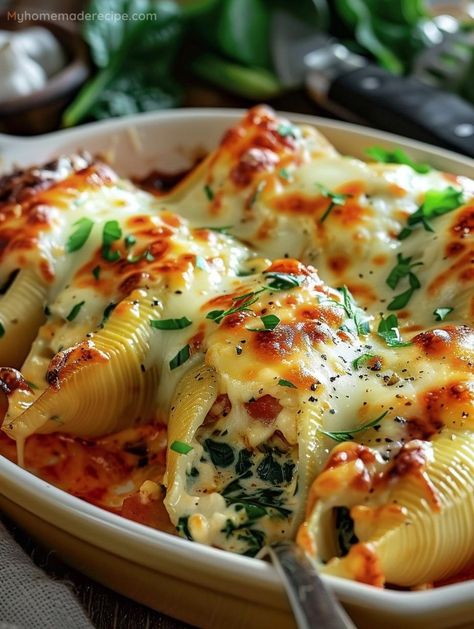 Indulge in the comforting embrace of Cheesy Spinach Stuffed Shells, where each shell is a treasure trove of creamy ricotta, lush spinach, and molten mozzarella. It's a culinary hug that promises to delight your senses. Cheesy Spinach Stuffed Shells, Turkey And Spinach Stuffed Shells, Chicken Spinach Stuffed Shells, Spinach Mozzarella Ravioli Costco, Stuffed Pasta Shells Ricotta Spinach, Spinach Stuffed Shells Recipe, Creamy Stuffed Shells, Stuffed Noodles Shells, Large Pasta Shells Stuffed