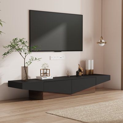 Sleek lines and simple structure shows modern and simplicity, the colour of white and black is timeless and won’t be boring, this media console would be your one of best choices for your living room | Wade Logan Bradden 78.7" W Storage TV Stand black/Brown/White, Solid + Manufactured Wood | C110067168_2049394721 | Wayfair Canada Tv Stand For 85 Inch Tv, One Bedroom Apartment Ideas Living Room, 85 Inch Tv Living Room, Simple Tv Console, Black And Wood Living Room, Modern Tv Stand Living Rooms, Furniture Goals, Apartment Furnishing, Dining Table Decor Everyday