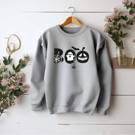 Sport gray Halloween unisex crewneck sweatshirt with glow in the dark accents. Halloween Crewneck Sweatshirt, Halloween Crewneck, Halloween Boo, White Accents, Transfer Vinyl, I'm Happy, In The Dark, Glow In The Dark, Heat Transfer