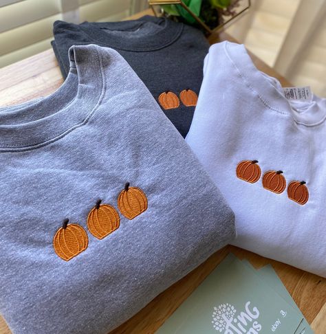 Pumpkin Embroidered Sweatshirt Crewneck is light weight, and perfect for layering! We use 4 UNISEX STYLE Brands: Smart Blank, Gildan, Cotton Heritage, & Hanes  The brand will depend on your size. All crewnecks are true to size.  However, if you enjoy a relaxed and lose fit, please size up.  ✈️ PRODUCTION TIME & SHIPPING:: Production Time: Sweatshirts are made within 3-5 business days from when the order is placed. Shipping Time: Standard Domestic Shipping  (3-5 business days after production tim Iron On Patches Ideas Sweatshirt, Fall Crewneck Sweatshirt Embroidery, Embroidered Fall Sweatshirt, Halloween Embroidered Sweatshirt, Fall Embroidery Designs Sweatshirt, Cute Fall Sweatshirts, Embroidered Halloween Sweatshirt, Fall Embroidered Sweatshirts, Iron On Patches Sweatshirt Ideas