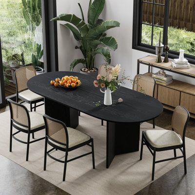 Introducing our exquisite Wood Grain Dining Table, a masterpiece of elegance and functionality. Crafted with precision and attention to detail, this table features a stunning wood grain finish that adds a touch of natural beauty to any dining space. Its circular design promotes intimacy and conversation, making it perfect for family gatherings or dinner parties. | Ebern Designs Oval Black Wood Top 67 in. Double Pedestal Base Dining Table Brown, Solid Wood | C111631344_1605071391 | Wayfair Canada Oval Wood Dining Table, Black Kitchen Table, High Dining Table, Rattan Dining Table, Midcentury Modern Dining Table, Kitchen Table Wood, Farmhouse Kitchen Tables, Mid Century Modern Dining, Farmhouse Dining Table