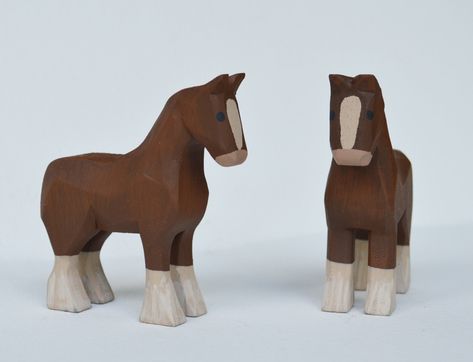 "A pair of Hand carved wooden Clydesdale Horse made from bass wood, hand painted with acrylic paints. Measurements are approximately 3\" inches long, 1\" wide and 3 1/4\" high *Animals are sold by the pair. Message me if you would like to purchase just one, I would be happy to set up a custom listing for you. Mo and Kelly Dallas have been making a living producing Hand Carved wooden Noah's Arks, Angels & other folk art in our home studio in rural Ohio for over 20 years. All of our products are h Hand Carved Wooden Toys, Hand Carved Wooden Animals, Whittled Animals, Wooden Animals Patterns, Whittling Patterns Beginner, Easy Whittling Projects, Horse Wood Carving, Wooden Diy Crafts, Art Sculpture En Bois