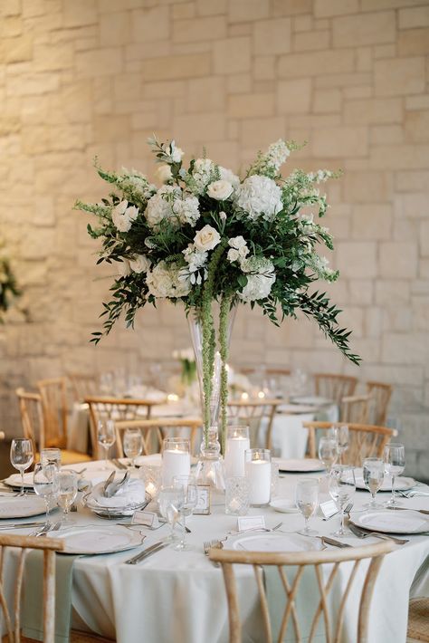 Tall organic green centerpiece Green Wedding Centrepiece, Green And White Wedding Centerpieces Round Table, White And Green Table Centerpiece, White Wedding Flowers Centerpieces Reception Ideas, Green Wedding Centerpieces Round Table, White And Green Wedding Flowers Table Centerpieces, Elevated Centerpieces Wedding, Green And White Centerpieces Wedding, Green And White Wedding Florals