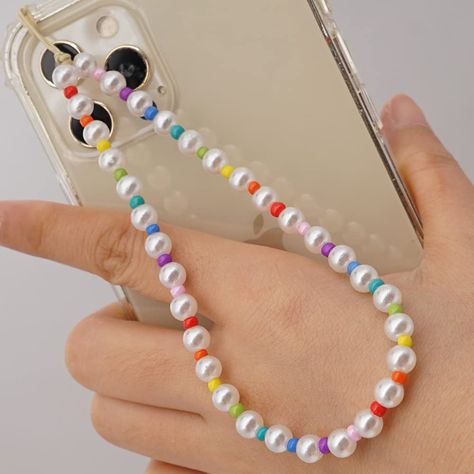 PRICES MAY VARY. Colorful, lively and super funny, These phone charm are made of colorful smiley beads,heart beads,letter beads,fruit beads and so on.It is a lovely design for women and girls to make them more attractive. The perimeter of the phone lanyard is about circumference 28cm(11 inch )+5cm(1.97 inch).They are made of acrylic and soft ceramic artificial beads.It is very suitable for ladies and girls.It is very suitable for ladies and girls.You can loop the strap through your mute button h Gelang Manik-manik, Wrist Lanyard, Bead Charms Diy, Hand Wrist, Gelang Manik, Beads Bracelet Design, Phone Chain, Phone Strap, Rainbow Beads