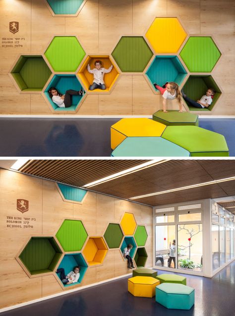 19 Ideas For Using Hexagons In Interior Design And Architecture // This elementary school has a play area featuring hexagon cubbies big enough to play in. Beehive Interior Design, School Waiting Area Design, School Waiting Area, Elementary School Ideas, Wall Nooks, Library For Kids, Kindergarten Architecture, Education Design Interior, Play Wall