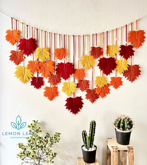 Welcome to my Etsy store. This colorful wall mural is a unique piece of our craft. A boho painting will be the highlight of your home. The product is 100% handmade with eco-friendly cotton yarn that is safe for you and your family. Product details: Color: many colors. Size: W: 57 inches ~ 145cm H: 37 inches ~ 95cm (from the hanging tree to the end of the longest leaf). Please message us if you have custom requirements for color and size. NOTE: - The color may vary a little bit due to screen settings. - The size may vary a bit due to the natural of individual handmade products. - The natural driftwood varies in shapes. - The wooden beads vary in shapes and color upon available. #Wall Decor, Bohemian Wall Decor, Boho Wall Hanging, Scandinavian Decor, Macrame Wall Hanging, Wall Art, Gifts For Wood With Macrame, Yarn Leaf Diy, Macrame Autumn Decor, Wall Photo Display, Window Bookshelf, Wallhanging Handmade, Macrame Leaf Wall Hanging, Leaf Art Diy, Autumn Wall Decor