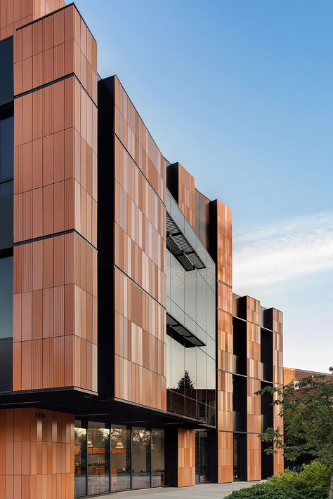 The building counters the tech industry's minimalist, austere aesthetic with a warm, welcoming environment for students and faculty. It features a unique design with a single alveolar ceramic panel, created in eight variations: scratched or smooth, and unglazed, matte, or gloss finish. @gresmanc  #architonic #architecture #facade #exteriordesign #facadedesign #exterior #facadesystem #modernarchitecture #buildingdesign #buildingelements Austere Aesthetic, Concrete Panel Facade, Industrial Building Facade, Industrial Facade, Bill And Melinda Gates, Acoustic Barrier, Ceramic Panel, Architecture Facade, Melinda Gates