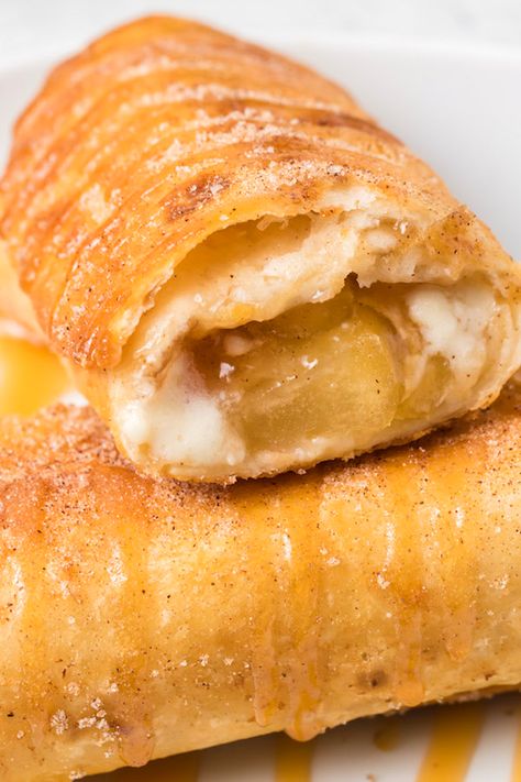 Deep-fried caramel apple cheesecake chimichangas. Cheesecake Chimichangas, Deep Fried Desserts, Fried Cheesecake, Chimichanga Recipe, Fried Dessert, Canned Apple Pie Filling, Caramel Apple Cheesecake, Apple Cheesecake, Fried Apples