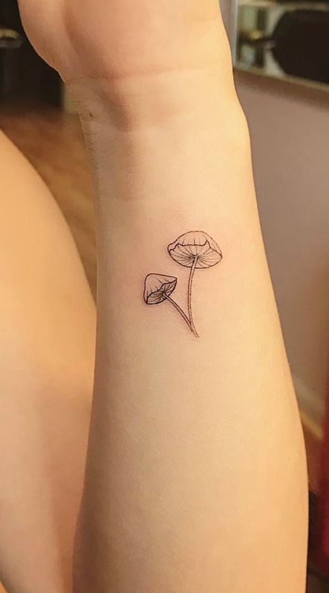 Discreet And Charming Wrist Tattoos You'll Want To Have #wristtattoos #tattooinspo #classytattoos #elegance Tattoo Mushroom Small, Delicate Mushroom Tattoo, Minimalist Tattoo Mushroom, Minimal Mushroom Tattoo, Mushroom Line Tattoo, Dainty Mushroom Tattoo, Tattoos Cottagecore, Small Tattoos Mushroom, Fine Line Mushroom Tattoo