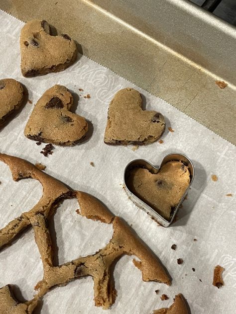 Homemade heart shaped chocolate chip cookies.🍪 Heart Chocolate Chip Cookies Aesthetic, Chocolate Chip Shape Cookies, Chocolate Chip Cookies Heart Shaped, Baking Heart Cookies, Love Heart Cookies, Heart Shape Chocolate Chip Cookies, Heart Baked Goods, Heart Shaped Cookies Aesthetic, Homemade Cookies Aesthetic