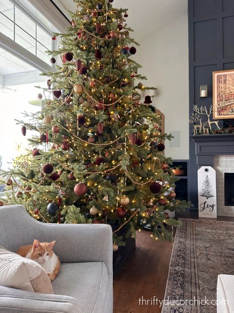 Chris Loves Julia Christmas Tree, Moody Boho Christmas, Christmas Tree Dark Academia, Moody Xmas Decor, Christmas Tree Ideas Red White Gold, Norwegian Spruce Christmas Tree, Kid Friendly Christmas Tree Decorations, Burgundy And Bronze Christmas Tree, Christmas Tree Themes Red And Gold