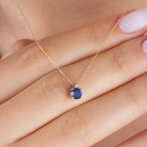 "Our single diamond tiny round sapphire necklace is an elegant jewel to wear whenever you want. A meaningful gift that can be given as a birthday gift to those born in September 🤍🤍 Special gifts for your special moments. We produce our jewelery for you in the most perfect way. 🤍🤍 All of our products are carefully crafted from 14k Solid gold and Real diamond...#the #Exploring #of #Accessories #Jewelry #Embracing #of #Beauty #Tidiness #Simplicity #StatementJewelry #Elegance #Minimalist #and Round Sapphire Pendant, Small Sapphire Necklace, Round Sapphire Necklace, Sapphire And Diamond Necklace, Sapphire Necklace Simple, Gold Sapphire Necklace, Single Diamond Necklace, December Birthstone Necklace, Necklace Sapphire