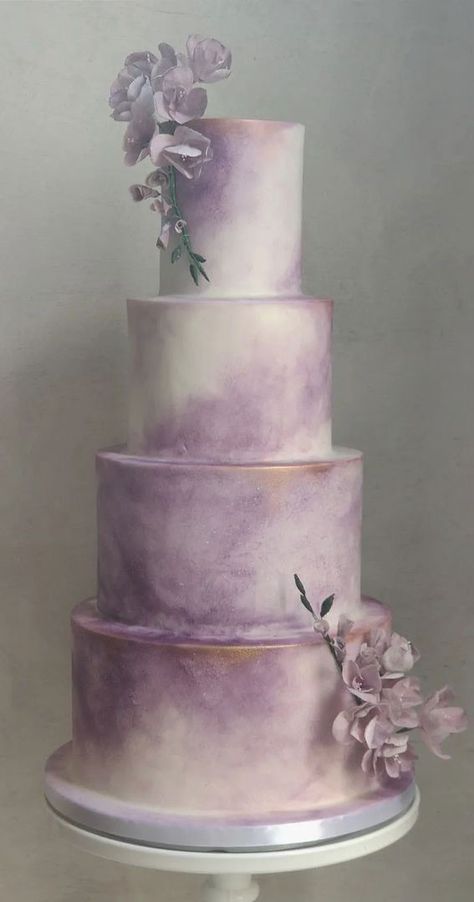 watercolour wedding cake, wedding cake ideas, wedding cake designs, four tier wedding cake, white wedding cake Lavendar Cakes Wedding, Wedding Cake Designs Lavender, Purple Silver Birthday Cake, Lavender Cake Wedding, Lavender And Silver Wedding Cake, White And Lilac Wedding Cake, Wedding Cake Purple And Green, Sage Green And Lilac Wedding Cake, Lavender And Pink Wedding Cake