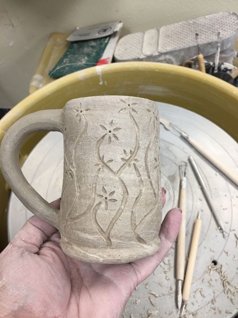 Greenware with hand carved flowers. Clay Pot Carving Designs, Ceramic Flower Carving, Carved Flowers Pottery, Ceramic Mug Carving, Ceramic Pitchers Ideas Handmade Pottery, Pottery Carving Ideas Simple, Mug Carving Ideas, Carved Ceramic Mugs, Pottery Carving Ideas Patterns