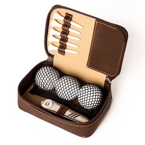 Designed with the aspiring pro or weekend golfer in mind, this compact zippered set makes storing and carrying essentials a breeze. It arrives packed with three balls, five tees and a handy hinged multi-tool that includes a divot repairer, ball marker and groove cleaner. All these zip up securely in a faux leather, easy-to-clean case that can join you anywhere out on the green. A foil debossed monogram makes it a thoughtful gift.    5.75"w x 3.75"d x 2"h  Vegan leather, stainless steel, plastic.  Imported.  Monogramming is foil debossed.     Ships directly from the designer without Mark & Graham signature gift wrap. Broker Gifts, Men’s Gifts, Manly Gifts, Golf Essentials, Giveaway Ideas, Giveaway Gifts, Golf Gifts For Men, Leather Store, Nails Today