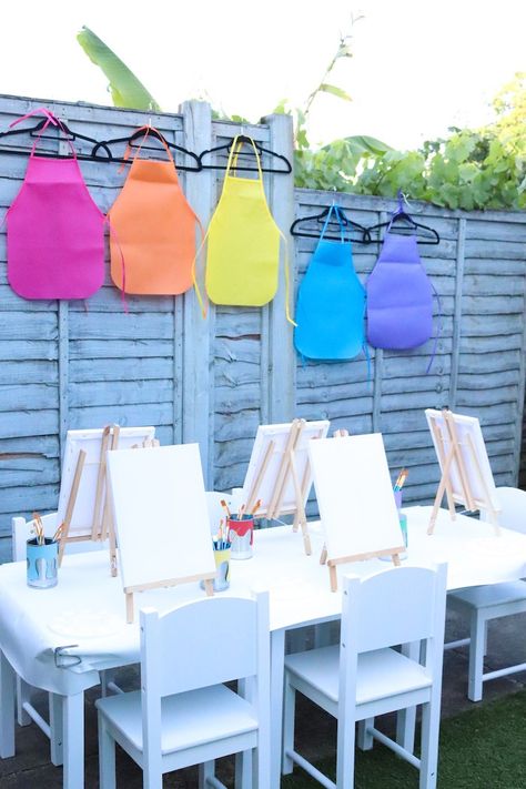 Kara's Party Ideas Backyard Rainbow Art Party | Kara's Party Ideas Curtain Entrance, Rainbow Art Party, Art Aprons, Backyard Kids Party, Art Party Decorations, Rainbow Ribbons, Party Activities Kids, Rainbow Feather, Kids Yard