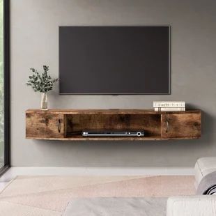 Millwood Pines Coombes Floating TV stand for TVs up to 75" | Wayfair Floating Wall Mount Tv Stand, Wall Mount Tv Shelf, Wall Mounted Media Console, Floating Entertainment Center, Under Tv, Tv Wand, Floating Tv Stand, Floating Tv, Tv Shelf