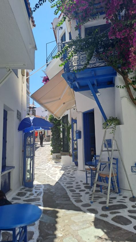 Aesthetic greek island with cobblestone walk blue and white shop Greek Astethic, Greek Core, Aesthetic Greek, Skiathos Island, Greek Aesthetic, Greek Town, Greek Blue, Europe Aesthetic, Greek House