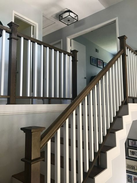 Before and after: stair railing. Traditional dark stained wood with modern white balusters. Gray walls, modern lighting. #interiordesign #stairs #remodeling #beforeandafter #homeimprovement #design #woodwork #banister #staircase Updated Stairs With Carpet, Changing Stair Railing, Wood Floor Stairs, Banister Remodel, Stair Railing Makeover, Burning Tree, Landing Ideas, Interior Stair Railing, Entryway Stairs